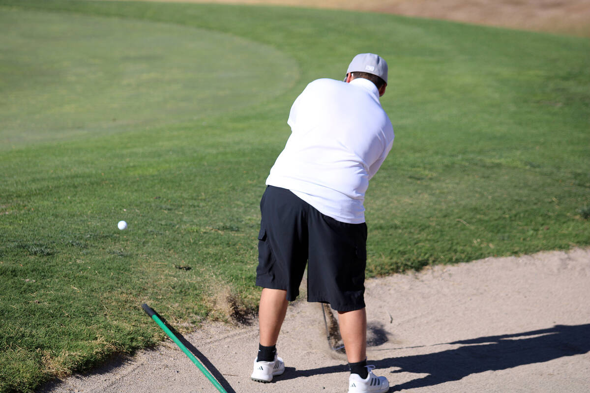 Rosemary Clarke Middle School seventh-grader Jacob De Santiago chips a ball out of the sand bun ...