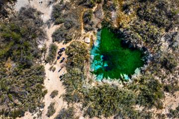 Visitors walk next to Fairbanks Spring within the Ash Meadows National Wildlife Refuge on Wedne ...