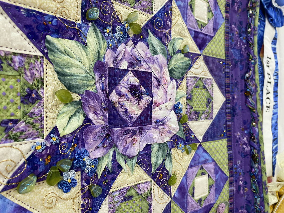 Titled "Lavender Lyrics", this 21.5-inch by 21.5-inch quilt made by Theresa Caselman earned sev ...