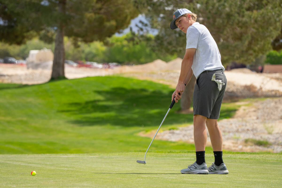 Pahrump Valley High School junior TC Hone attempts to knock down a putt to finish his round dur ...