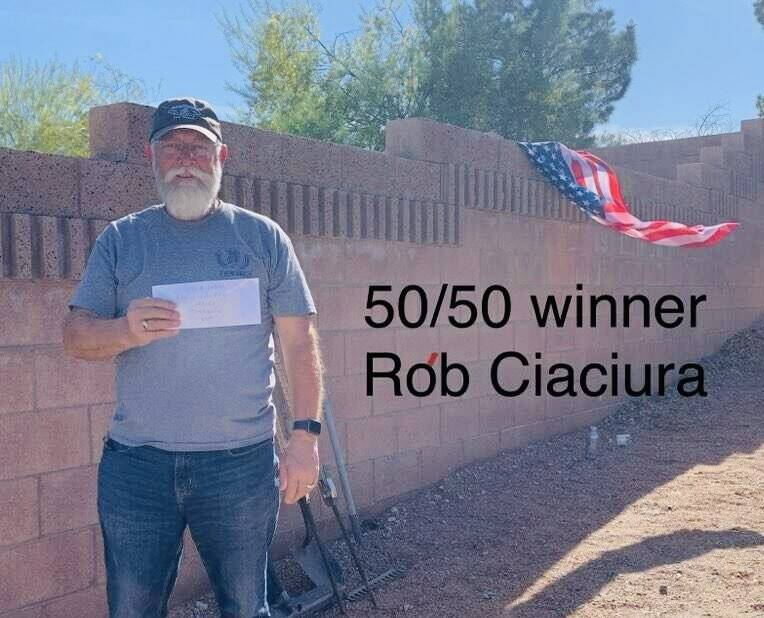 Shoes $ Brews 50/50 raffle winner Rob Ciaciura proudly displays his winnings following the East ...