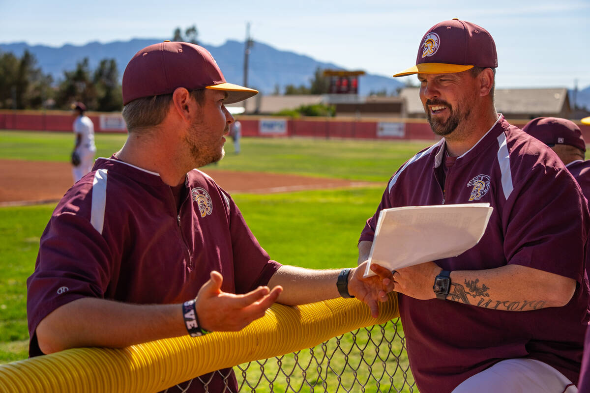 Pahrump Valley High School head coach Drew Middleton and assistant coach Raymond Montanez share ...