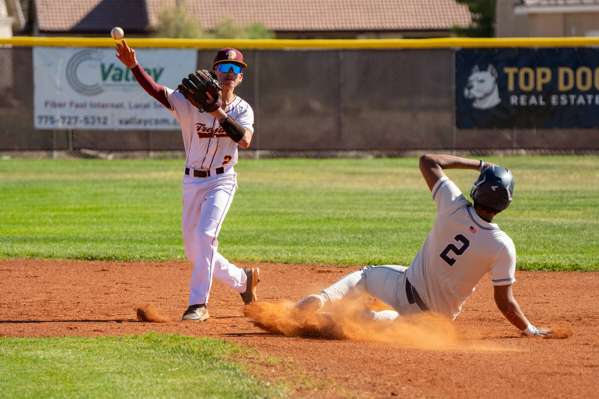 Pahrump Valley High School infielder Dominic Chiancone attempts to turn a double play at second ...
