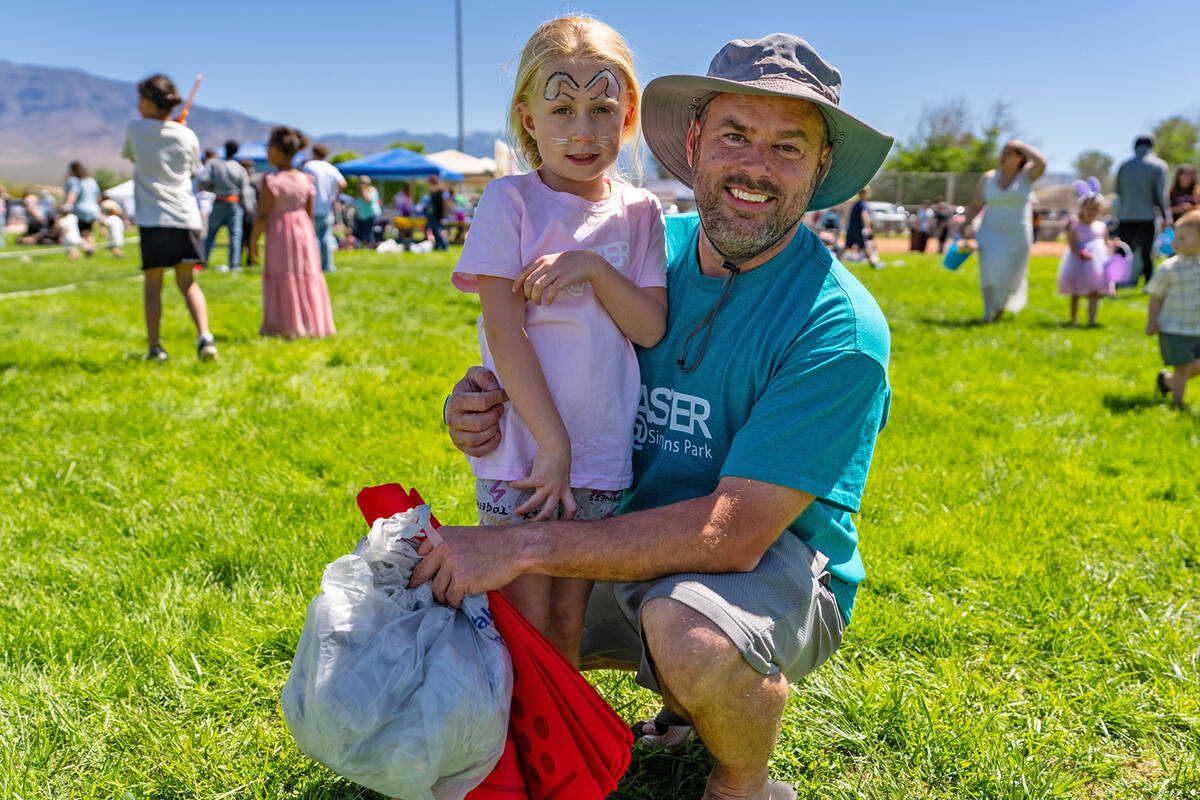 D.J. Mills and oldest daughter Sadie pose for a photo at Easter at Simkins Park. This event is ...