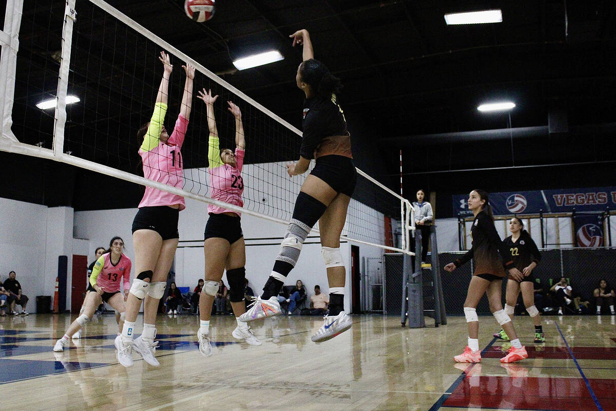 Pahrump Valley Volleyball Club and PVHS senior Heavenly Ware sends a kill over the net during t ...
