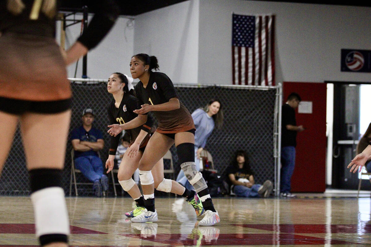 Pahrump Valley Volleyball Club teammates Heavenly Ware and Xe'ane Kamanu set their feet before ...