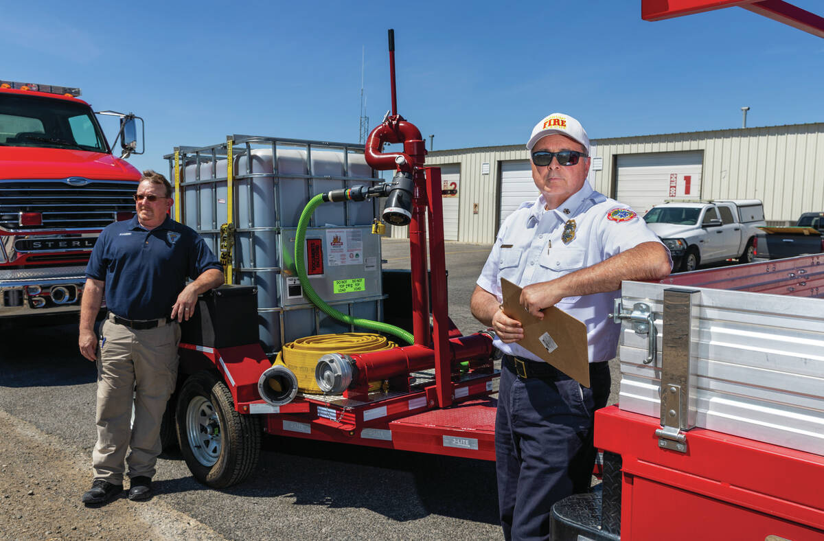 Fire Chief Scott Lewis with the town of Pahrump, right, with administrative assistant Patrick L ...
