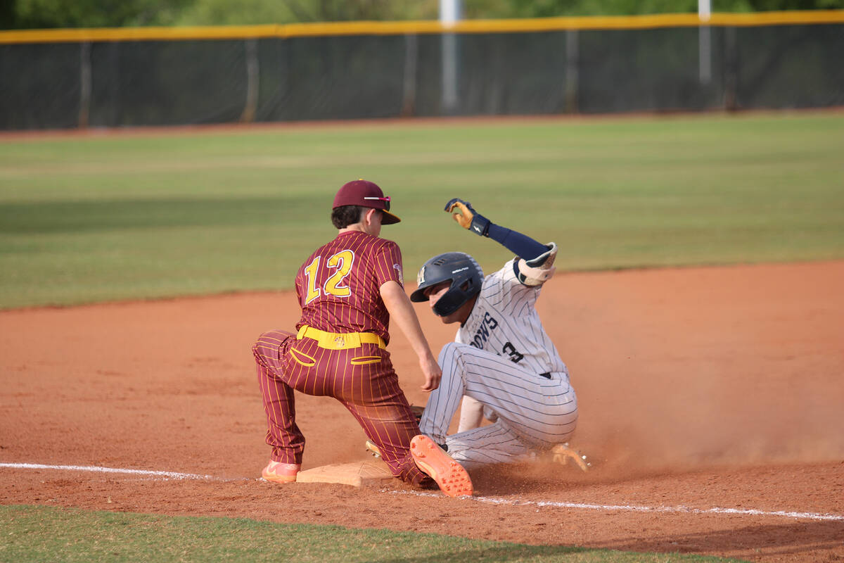 Pahrump Valley High School sophomore Anthony Montanez attempts to put the tag down on a Mustang ...