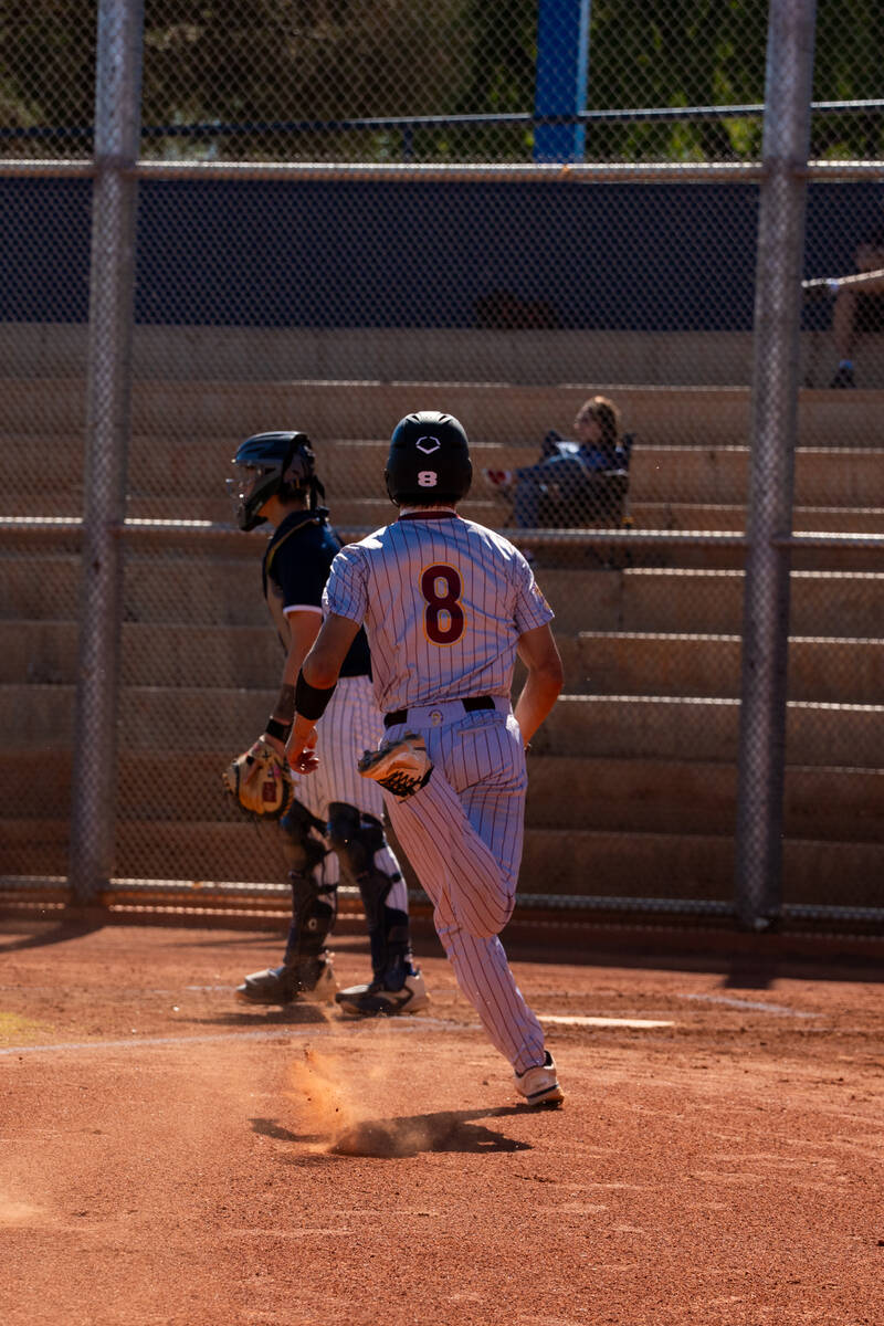Pahrump Valley High School senior Kayne Horibe comes in to score against Boulder City on the ro ...