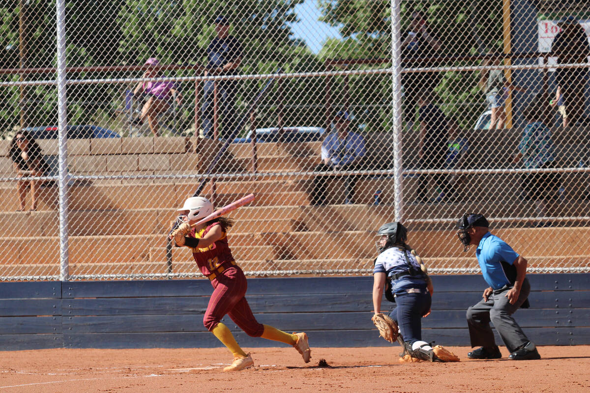 Pahrump Valley High School sophomore catcher Mariah Gray puts the bat on the ball during the Tr ...