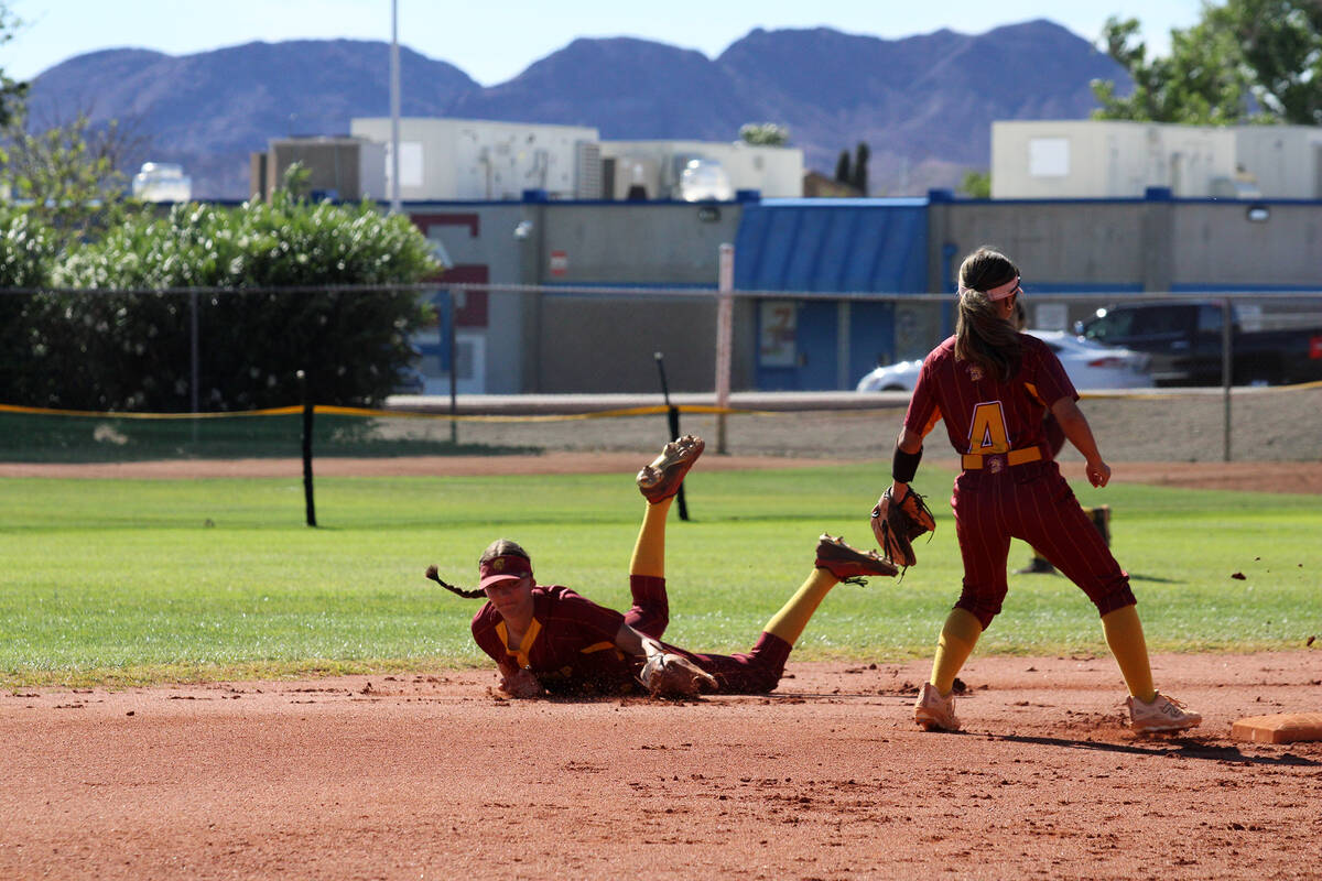 Pahrump Valley High School freshman Olivia Veloz lays out behind second base for the diving sto ...