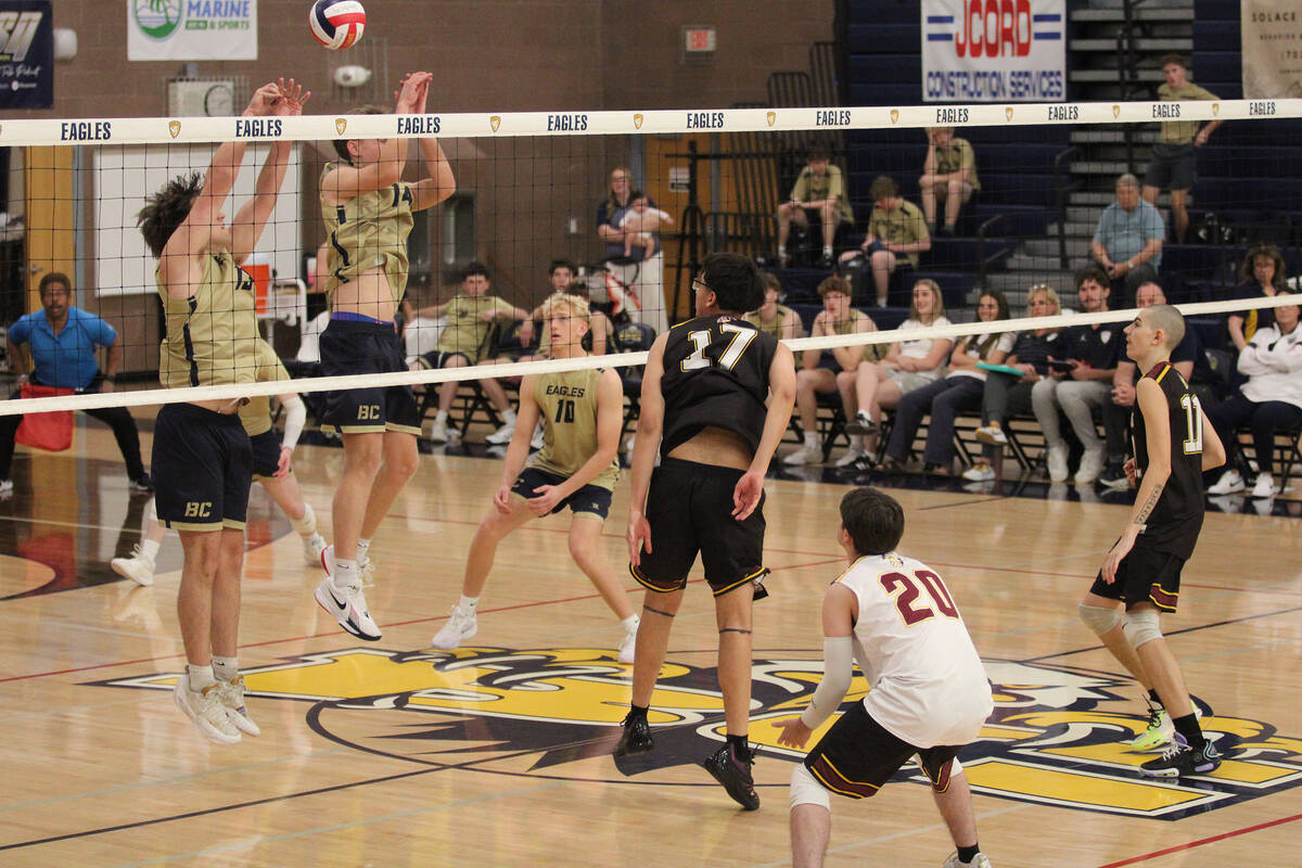 Pahrump Valley High School senior and outside hitter Andy Sanchez attempts to send a kill back ...