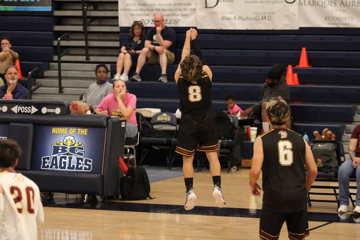 Pahrump Valley High School senior Elijah Thompson extends nearly out-of-bounds to try to keep t ...