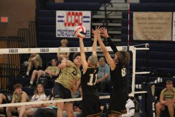 Pahrump Valley High School boys volleyball players George Anderson and Elijah Thompson attempt ...