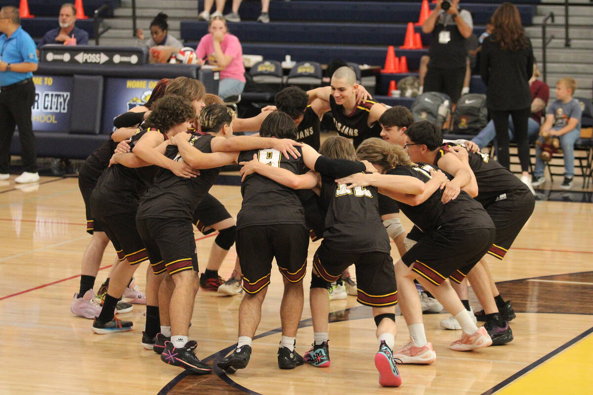 Pahrump Valley High School's varsity boys volleyball program gets amped prior to their match ag ...