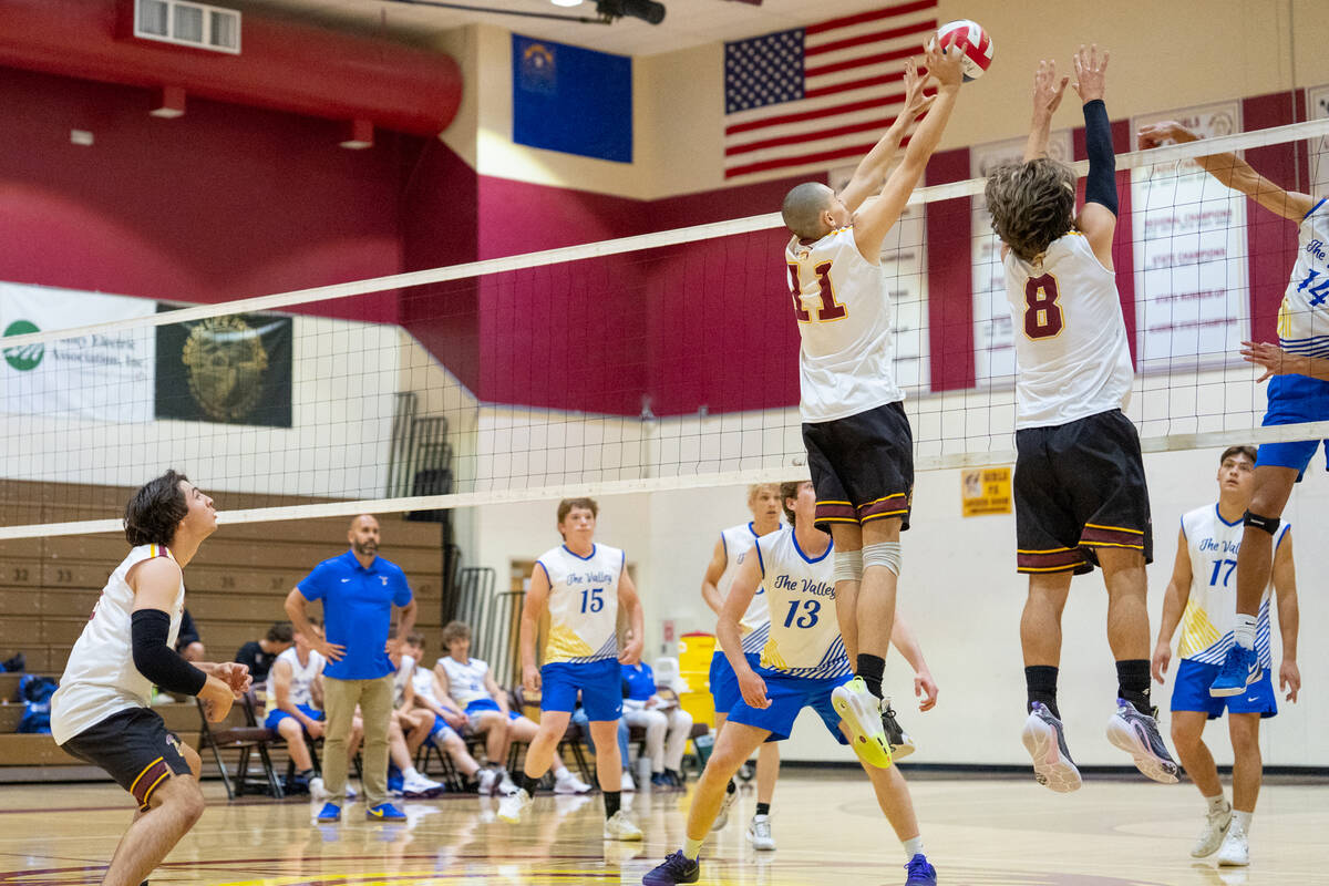 Pahrump Valley High School junior George Anderson gets his hands on a block in the Trojans' hom ...