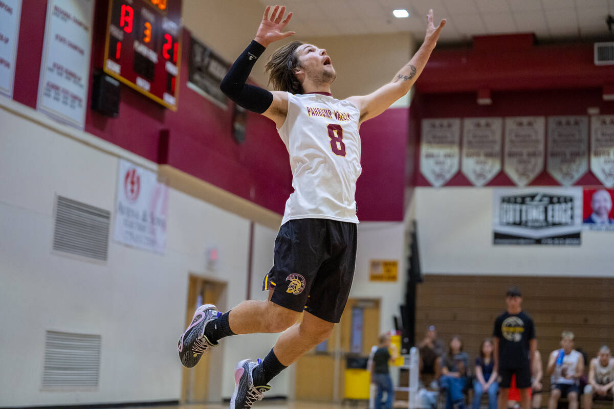 Pahrump Valley High School senior Elijah Thompson flies into the air during his serve attempt i ...