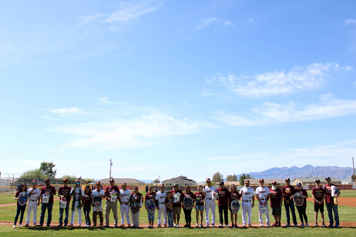 Seniors and their families line up on the first base line prior to their exhibition against Lak ...