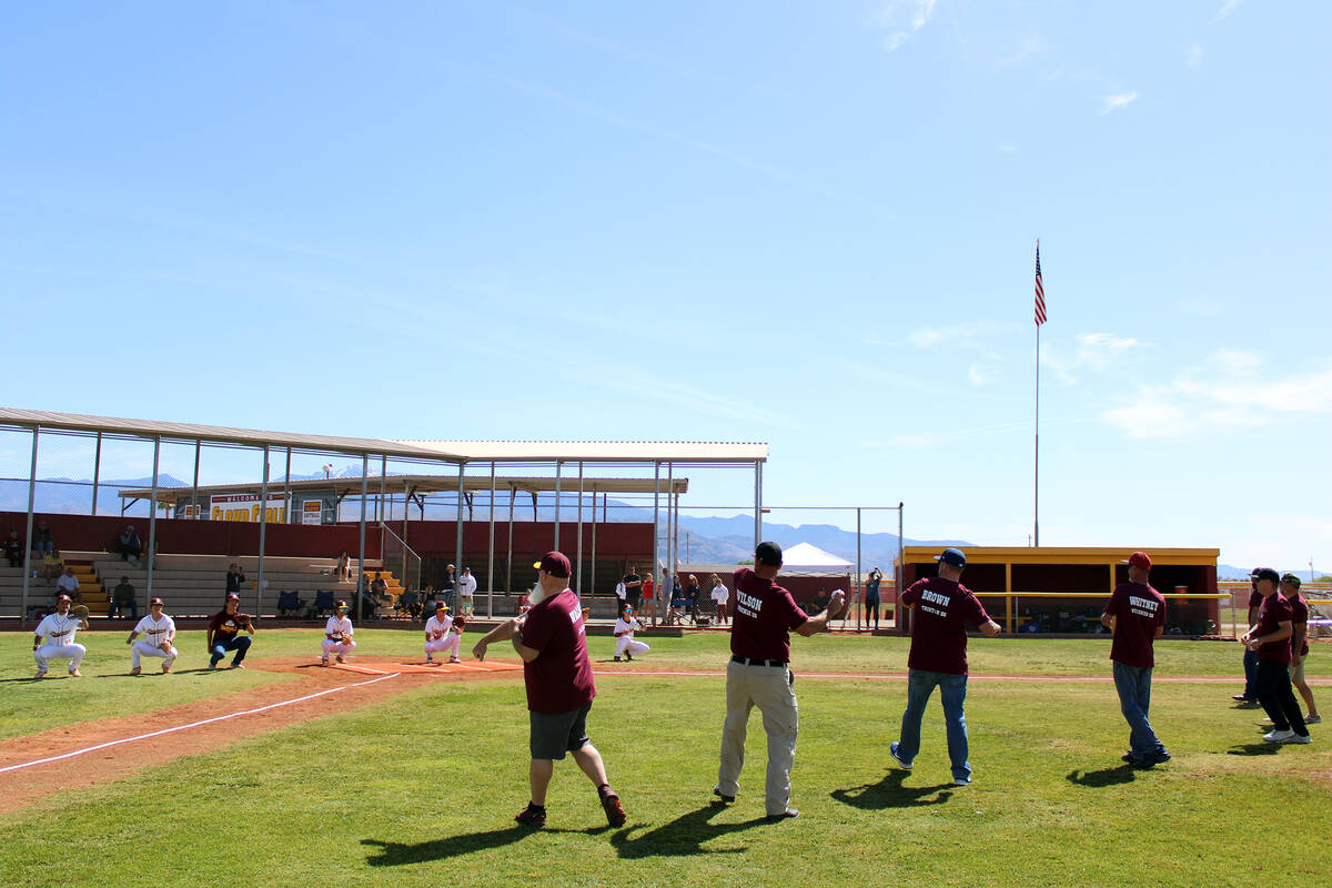 Senior dads throw out the first pitch to their soon-to-be graduating sons prior to the Trojans' ...