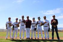 Pahrump Valley High School's graduating seniors pose with Trojans head coach Drew Middleton nea ...