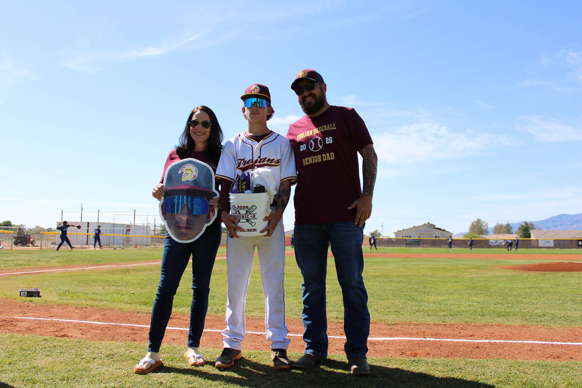 Pahrump Valley High School senior Dominic Chiancone and his family are honored before the Troja ...