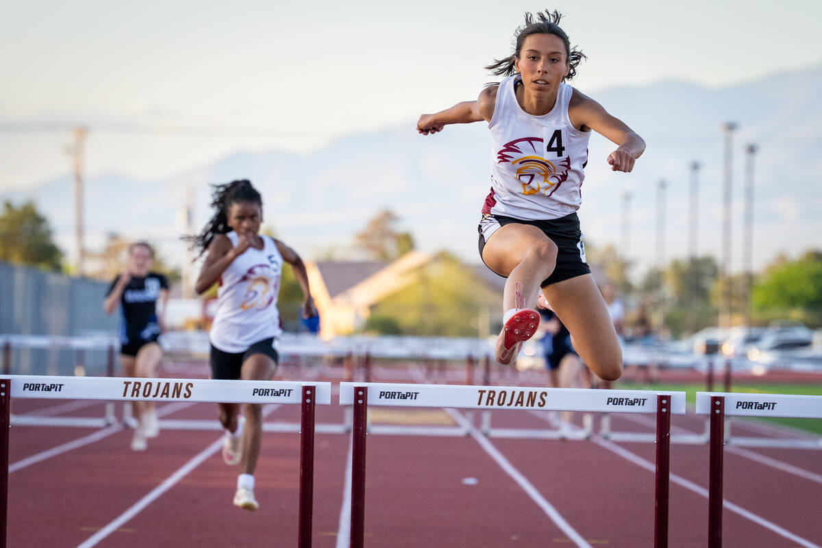 Pahrump Valley High School senior Julianna Ondrisko hurdles with ease taking first place in the ...