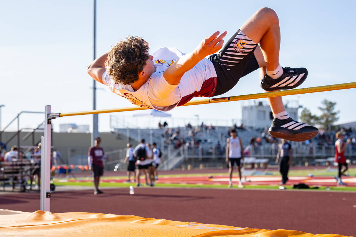Pahrump Valley High School freshman Evan Strain participates in the high jump event during the ...