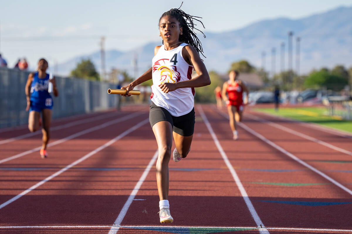 Pahrump Valley High School senior Diona Nixon prepares to cross the finish line in first place ...