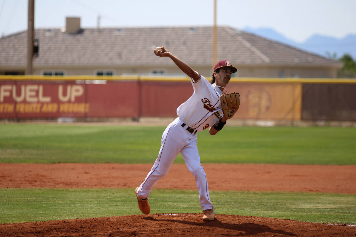 Pahrump Valley High School senior Vinny Whitney back-picks to first base during Senior Day agai ...
