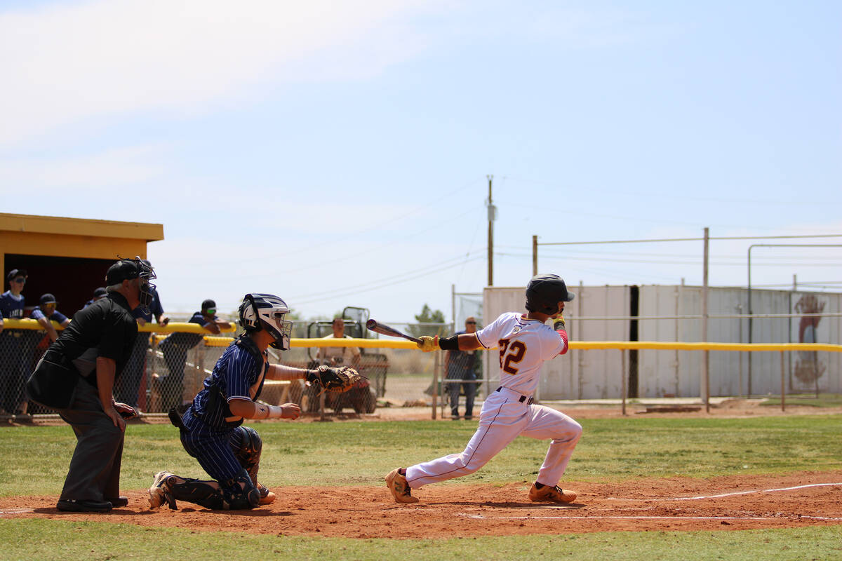 Pahrump Valley High School junior Tony Whitney singles up the middle during Senior Day against ...