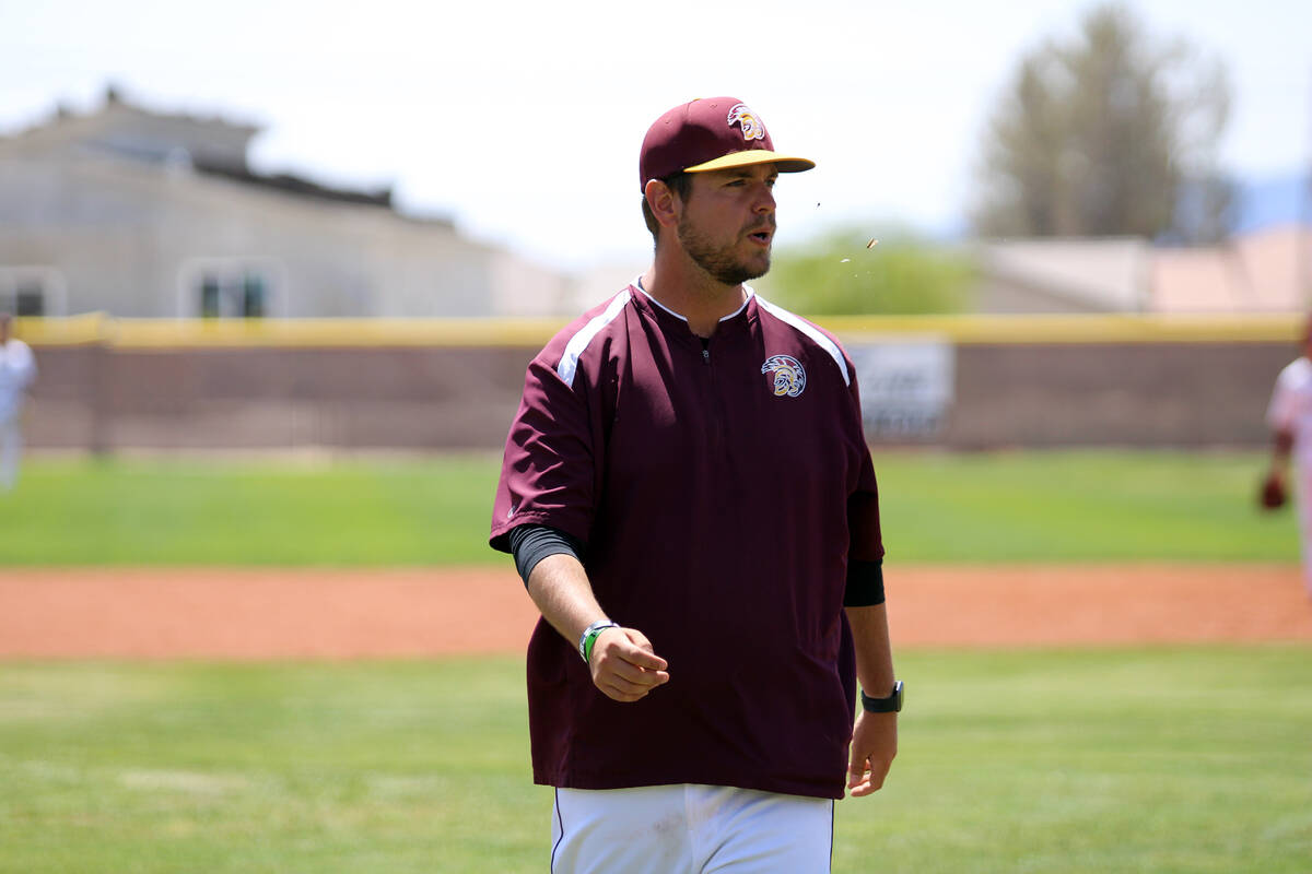 Pahrump Valley High School varsity baseball head coach Drew Middleton expels a few sunflower se ...