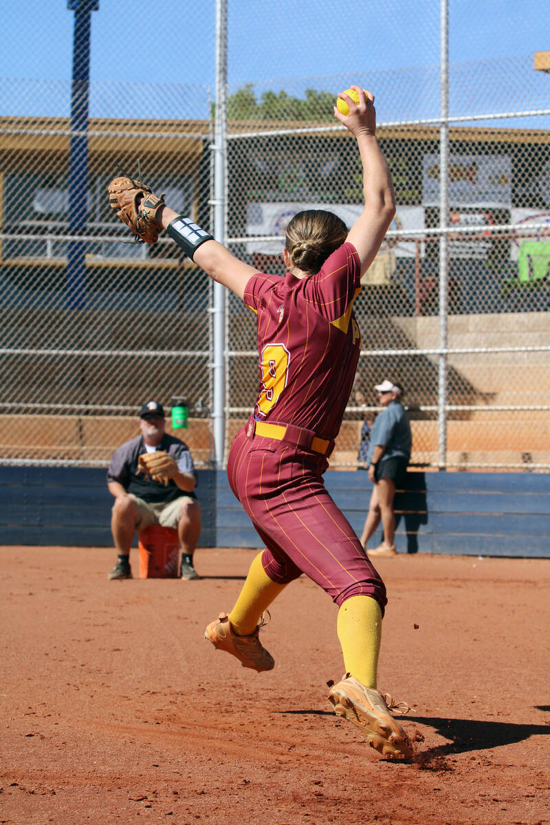Pahrump Valley High School freshman starting pitcher Jaycie Hayes warms up with her father, Tro ...