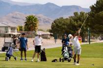 Pahrump Valley High School boys golf junior Travis Floyd tees off during the Trojans' second le ...