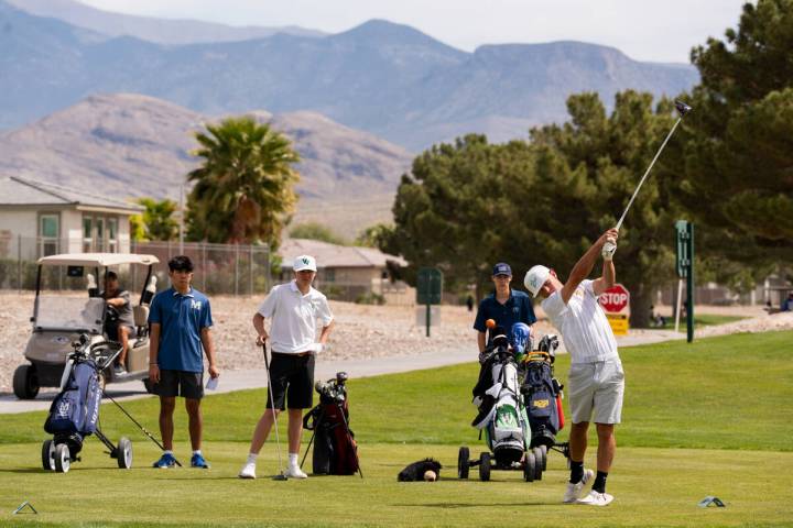 Pahrump Valley High School boys golf junior Travis Floyd tees off during the Trojans' second le ...