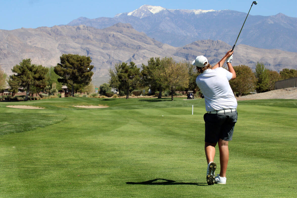 Pahrump Valley High School boys golf freshman Brody Myers tees off during the Trojans' first le ...