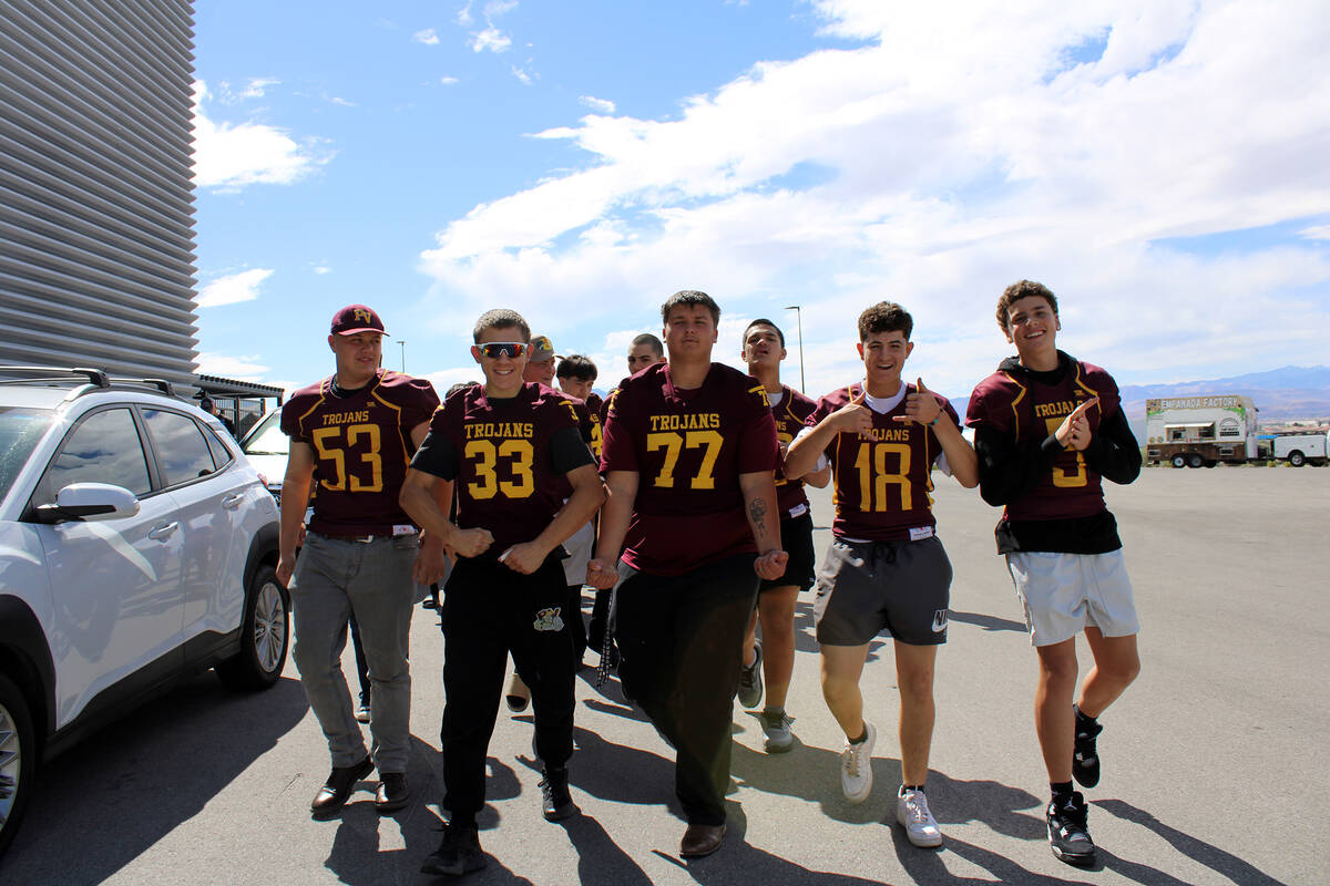 Pahrump Valley High School's Varsity and JV program excitedly prepare to enter the Raiders trai ...