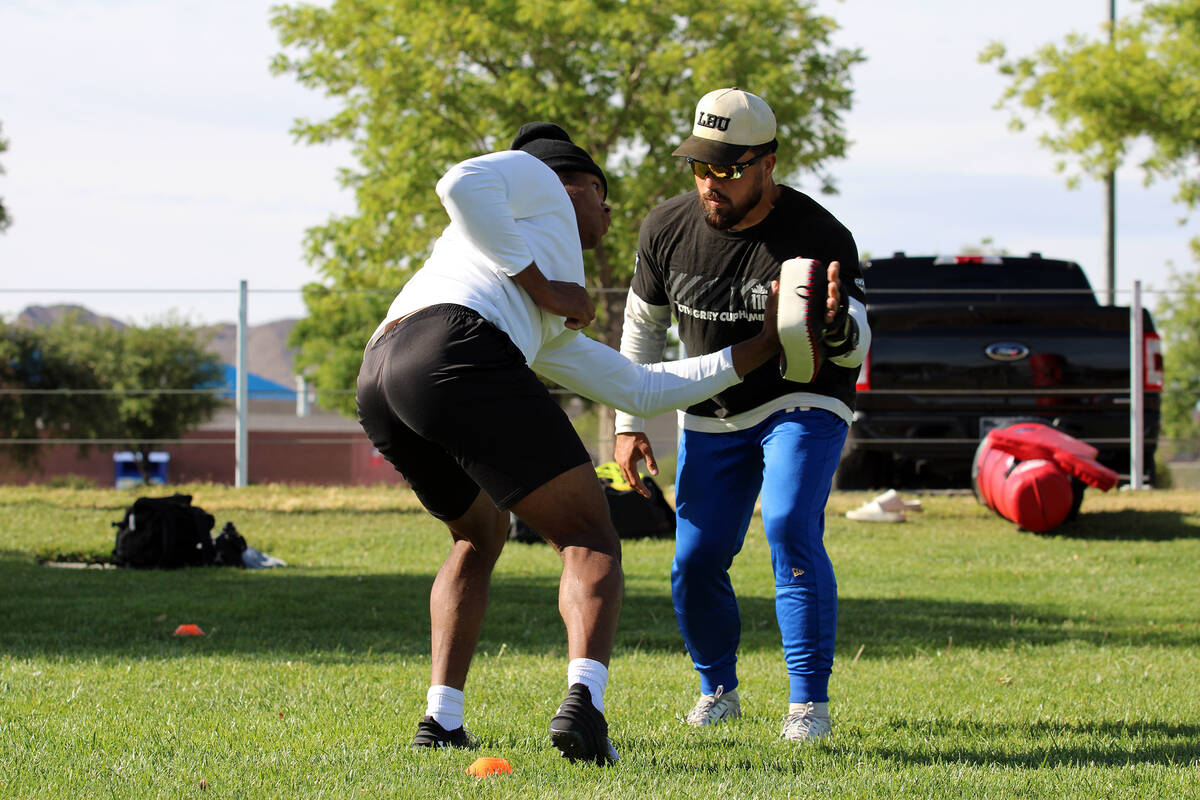 Pahrump Valley High School 3-star junior LB Iyan Bosket runs a sequence of drills with Les Maru ...