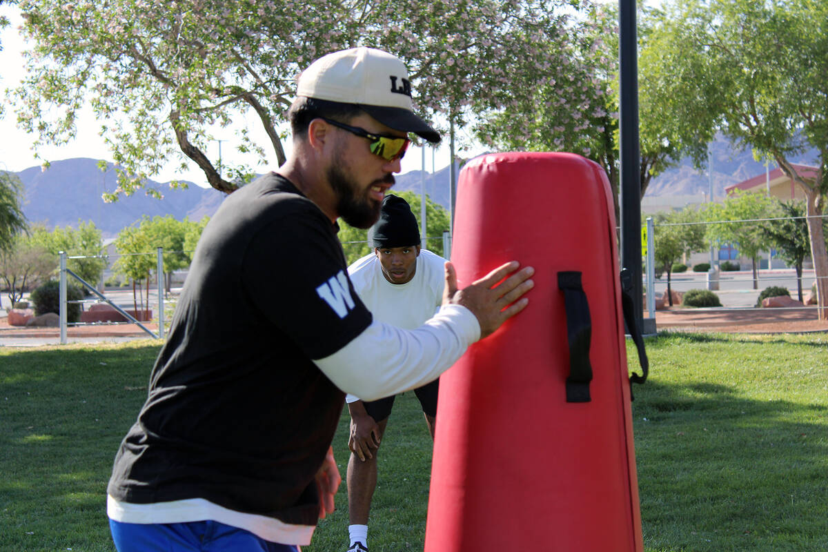 Pahrump Valley High School 3-star junior LB Iyan Bosket runs a sequence of drills with Les Maru ...