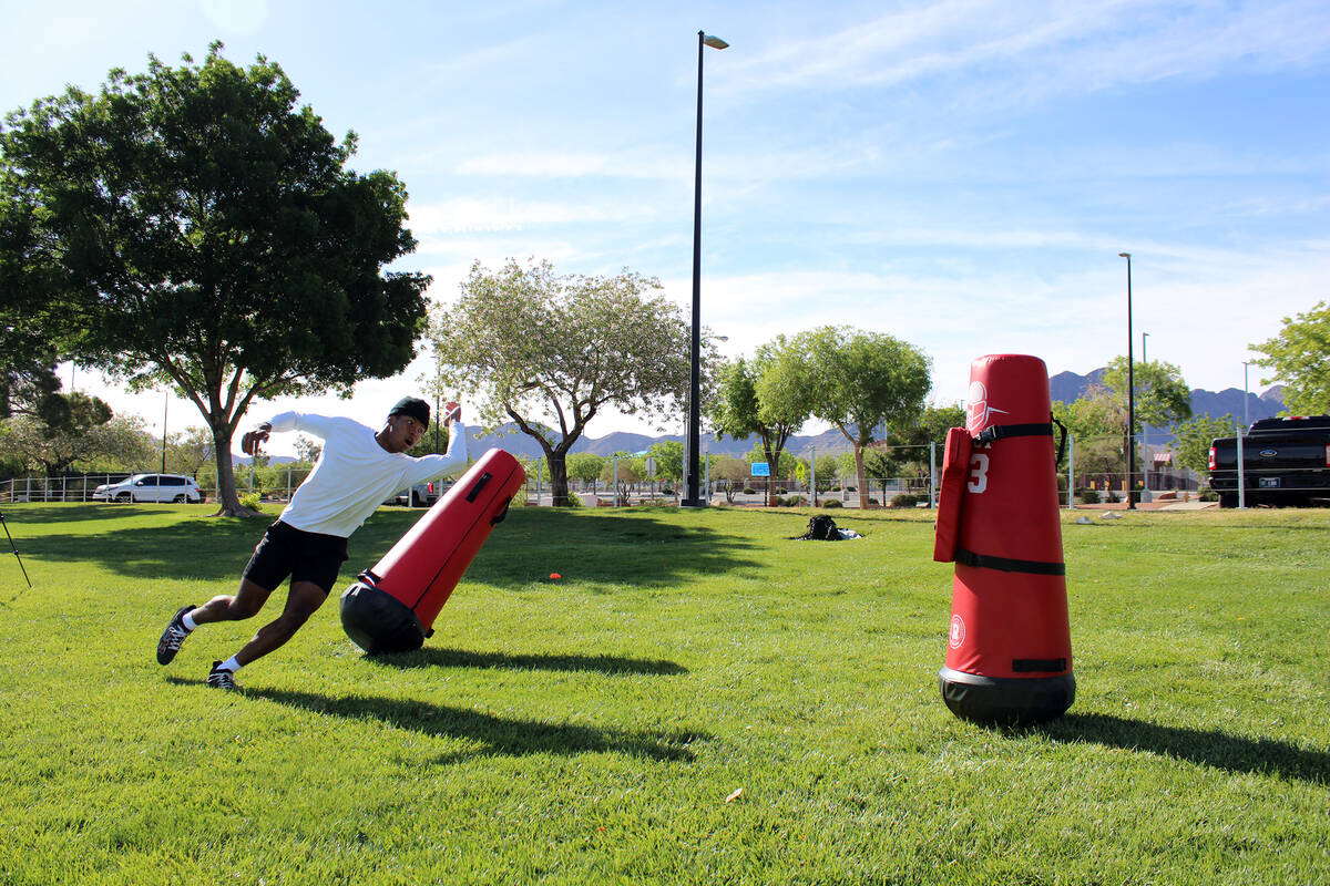 Pahrump Valley High School 3-star junior LB Iyan Bosket runs a sequence of drills with Les Maru ...
