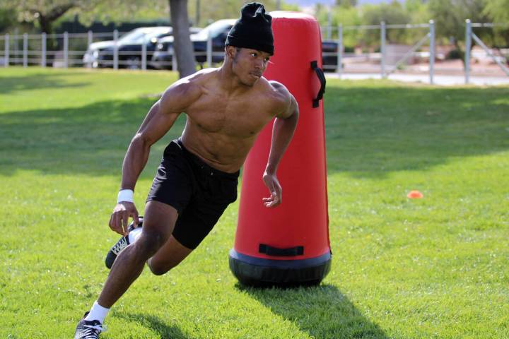 Pahrump Valley High School 3-star junior LB Iyan Bosket runs a sequence of drills with Les Maru ...