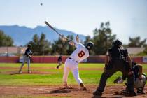 Pahrump Valley High School senior Kayne Horibe lifts a ball deep off a Canyon Springs pitcher d ...