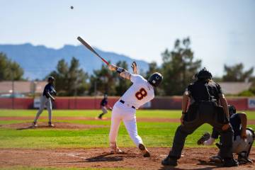 Pahrump Valley High School senior Kayne Horibe lifts a ball deep off a Canyon Springs pitcher d ...