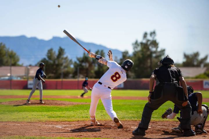 Pahrump Valley High School senior Kayne Horibe lifts a ball deep off a Canyon Springs pitcher d ...