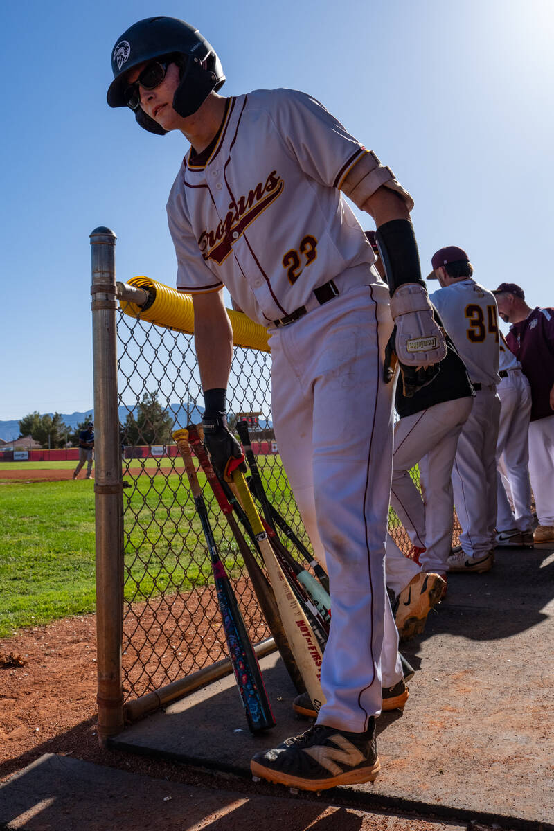 Pahrump Valley High School junior catcher Ben Cimperman grabs his bat before heading to the on- ...