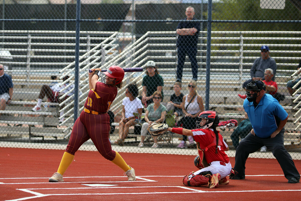 Pahrump Valley High School junior Evalenne Armendariz punches a ball through the infield during ...