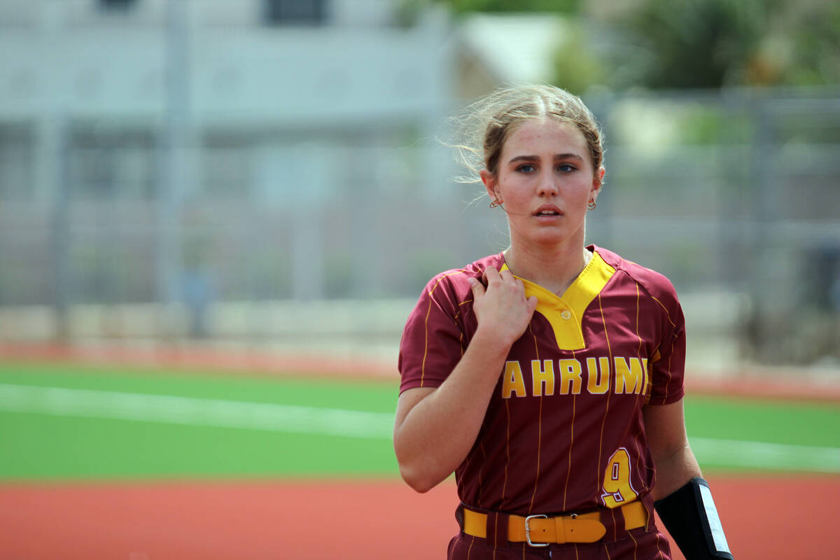 Pahrump Valley High School's starting pitcher and freshman Jaycie Hayes escapes a tight jam in ...
