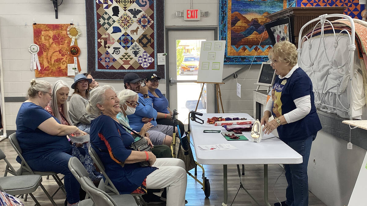 Shadow Mountain Quilters Founder Lynn McDonald leads a demonstration on fabric roses during the ...