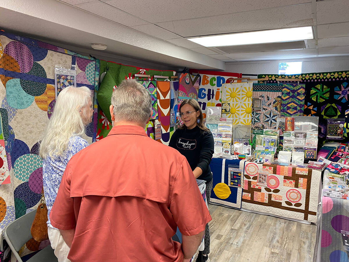 In addition to displays of fabric art, the Pins and Needles Quilt Show included vendors, such a ...