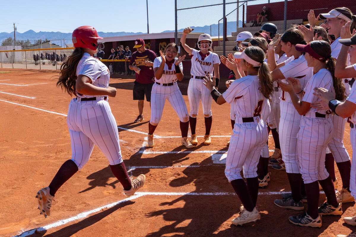 Pahrump Valley High School junior Evalenne Armendariz celebrates with her teammates following a ...