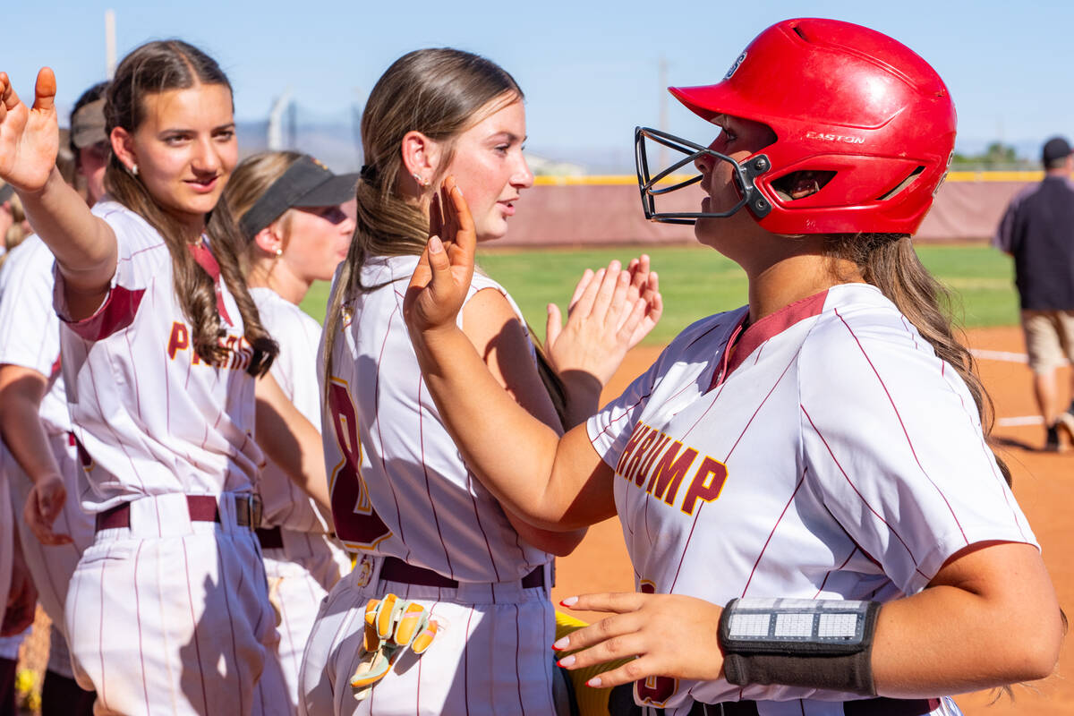 Pahrump Valley High School junior Evalenne Armendariz celebrates with her teammates following a ...